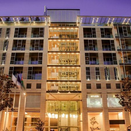The Abdali Boulevard Hotel Amman Bagian luar foto The hotel at night