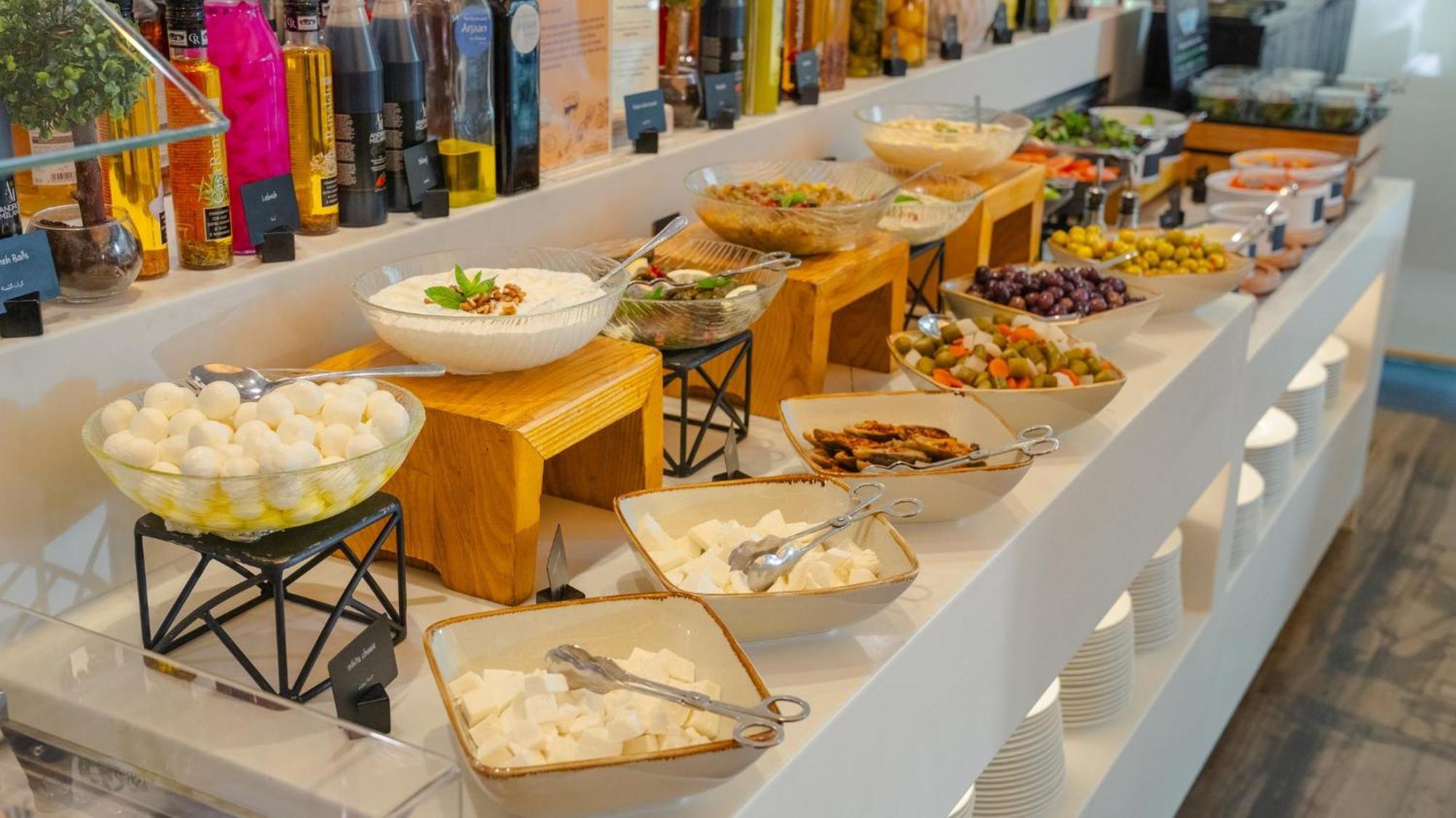 The Abdali Boulevard Hotel Amman Bagian luar foto A selection of Greek meze